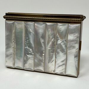Volupte vintage MOP compact with multi compartments and original comb.